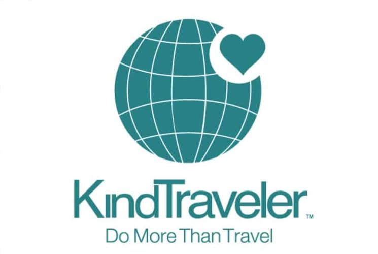 Logo of KindTraveler featuring a globe and a heart, with the tagline "Do More Than Travel."